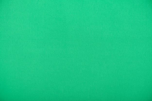 Têxtil verde natural, tecido liso como textura ou plano de fundo