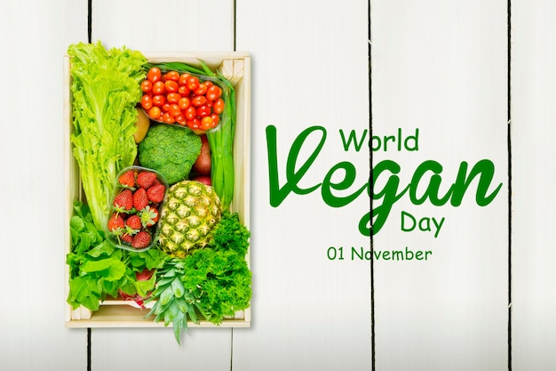 Texto do dia mundial vegano com caixa cheia de legumes