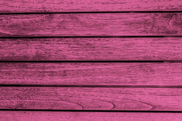 Textur aus Holz und alten verlorenen Planken in rosa Farbe