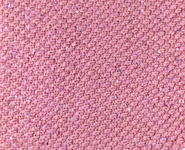 Textur aus rosa Strickmaterial