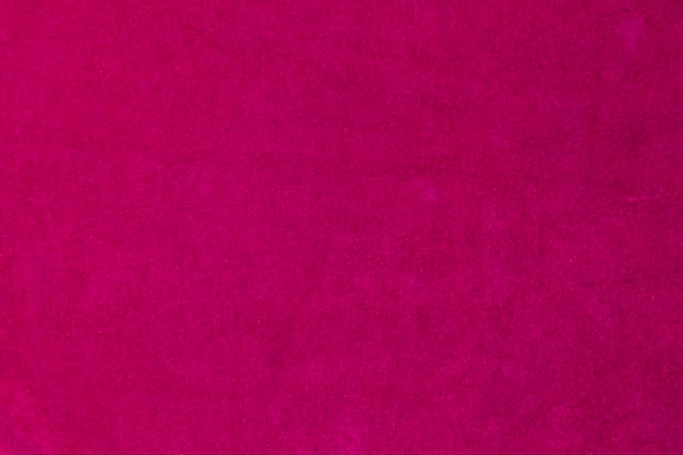 Textur aus rosafarbenem Samtstoff, der als Hintergrund verwendet wird. Rosafarbener Stoffhintergrund aus weichem und glattem Textilmaterial. Es gibt Platz für Textx9