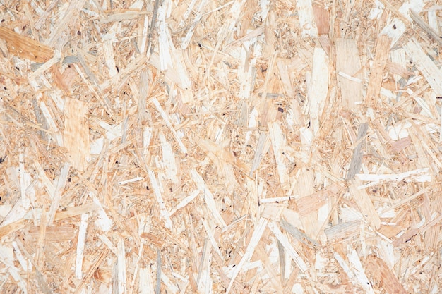 Textur der alten gepressten Holz-OSB-Platte. Oriented Strand Board in der Sonne verblasst