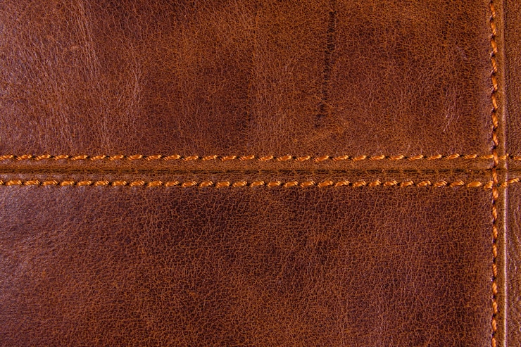 Foto textur des naturbraunen leders und der nähte