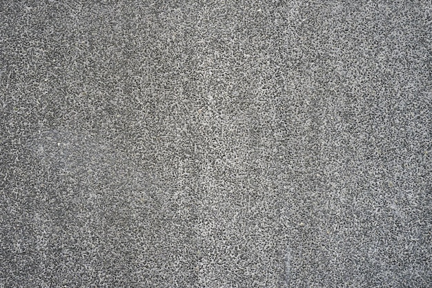Textur einer grauen Wand in einem kleinen Stein