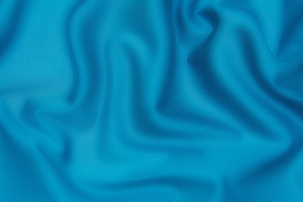 Textur, Hintergrund, Muster. Textur aus tidewater blue oder ruhigem Seidenstoff. Schönes Gezeitenwasser oder ruhiger weicher Seidenstoff.