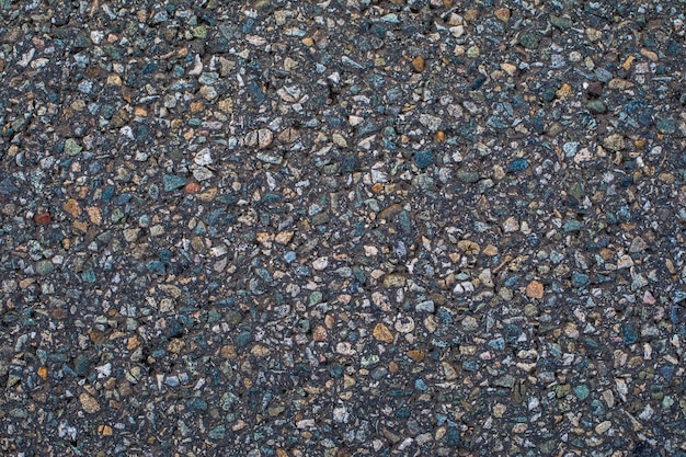 Textur von Asphalt aus kleinen Steinen. Hintergrund für den Desktop.