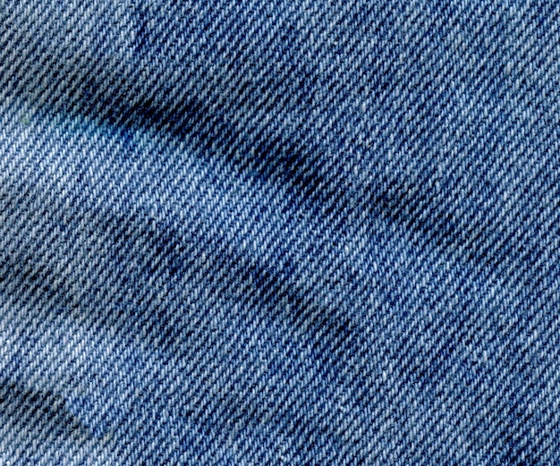 Textur von Blue Jeans Textil Leere hellblaue, natürliche, saubere Denim-Textur