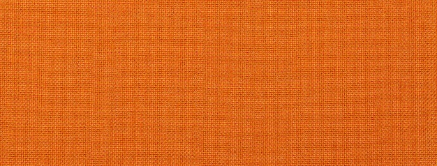 Textur von dunkelorangefarbenem Hintergrund aus Textilmaterial mit Weidenmuster Vintage-Ingwer-Stoff