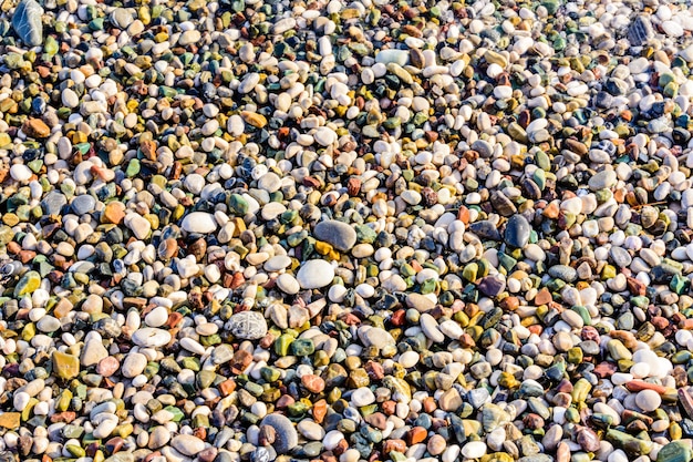 Textur von Kieselsteinen am Meer Natürlicher Hintergrund