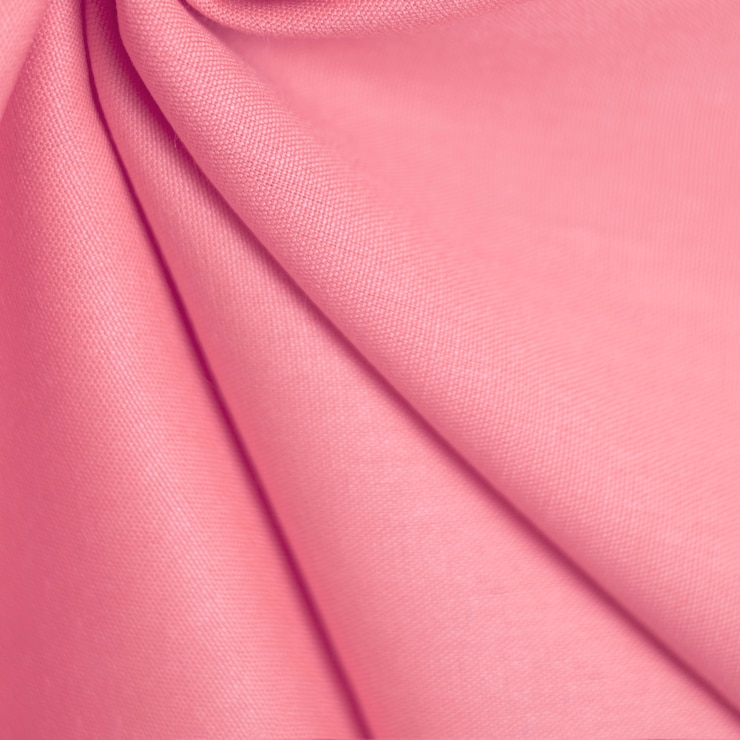 Foto textur von zarten rosa stoff. selektiver weicher fokus.