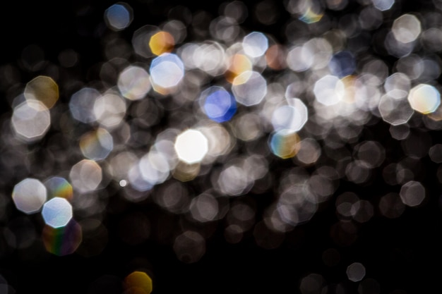 Foto textura abstracta del bokeh en fondo negro