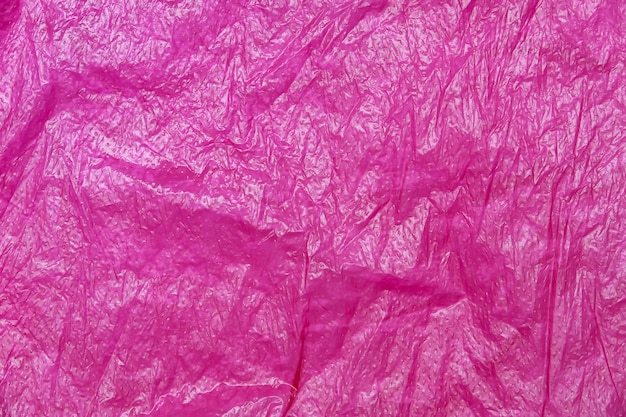 Foto textura abstracta de bolsa de plástico lila rojo arrugado