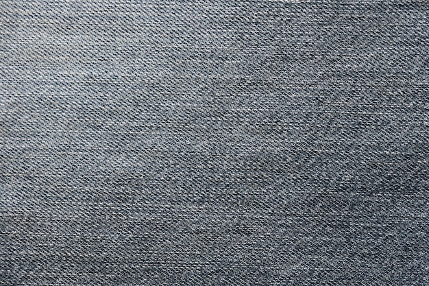 Textura abstrata detalhada de pano de denim azul escuro Imagem de fundo de tecido de calças de denim usado velho