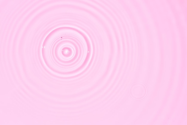 Textura abstrata do fundo da superfície da água com salpicos e bolhas Cor rosa