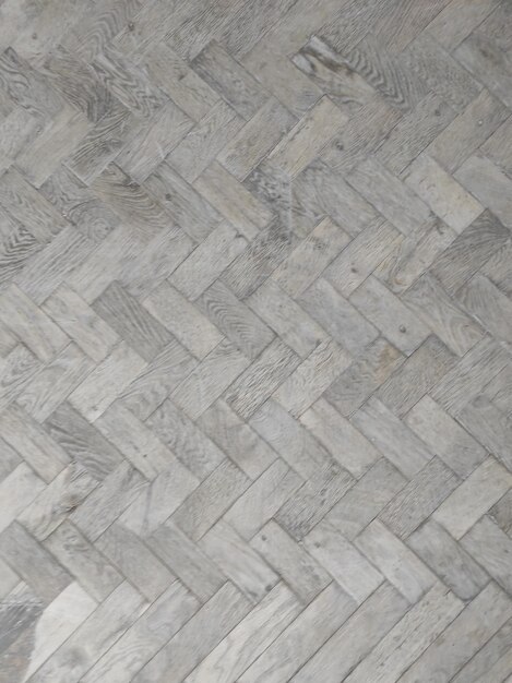 Foto textura de adoquín piedras de pavimento grises fuera de primer plano diseño en blanco
