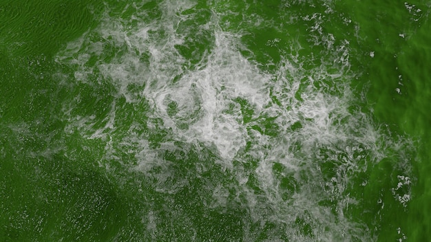 Textura de agua verde con olas y espuma.