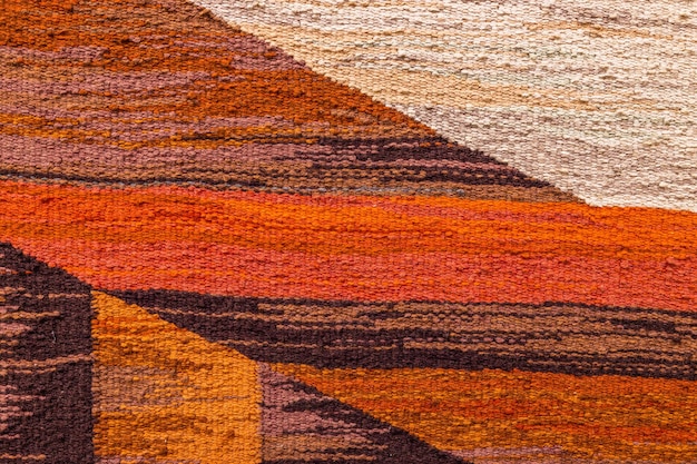 Textura de alfombra retro con patrón geométrico hecho a mano