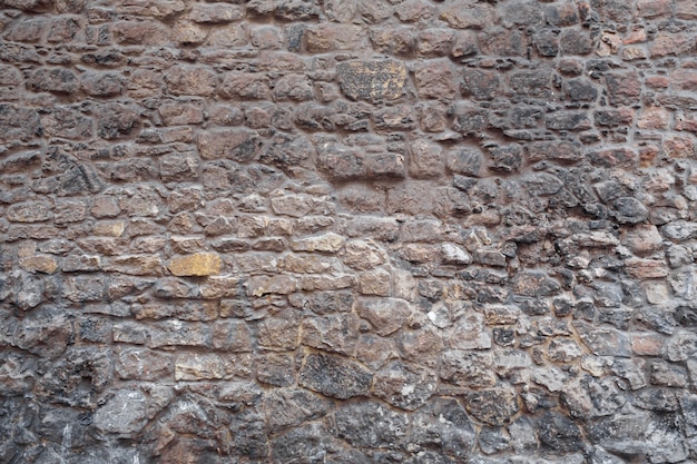 Textura. Alvenaria de parede. Edifício histórico de perto.