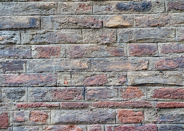 Textura antiga da parede de tijolos em Siena, região da Toscana, Itália