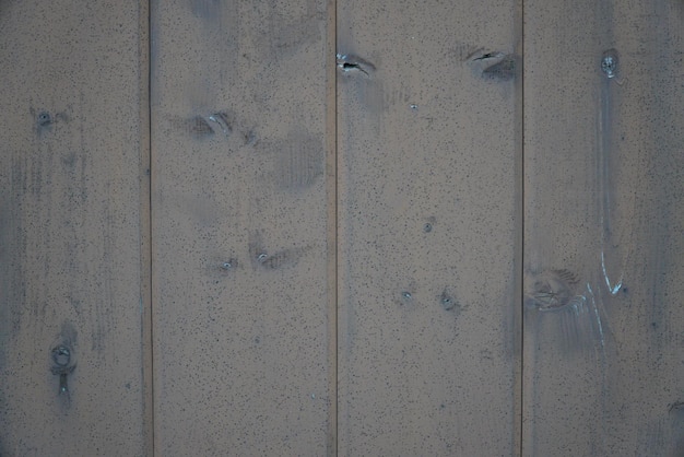 La textura de una antigua valla hecha de tablas de madera en primer plano