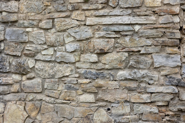 Textura de un antiguo muro de piedra natural