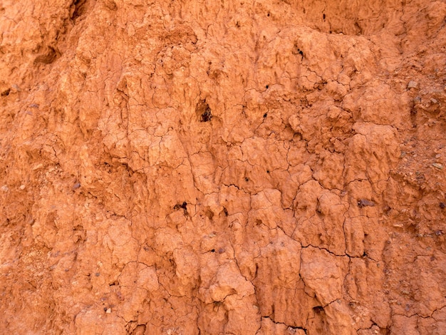 Foto textura de arcilla roja patrones naturales naturales primer plano de fondo rojo seco