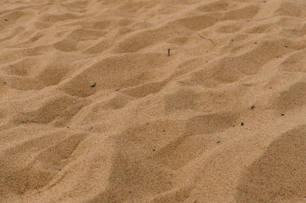 Textura de arena naranja. Grano fino. De cerca.