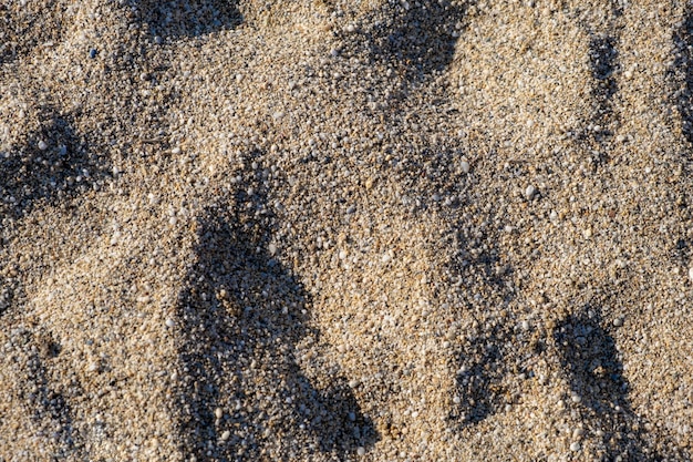 La textura de la arena pura en la playa o en el desierto