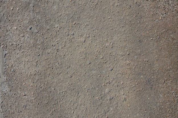 Textura de asfalto gris sucio y sombrío.