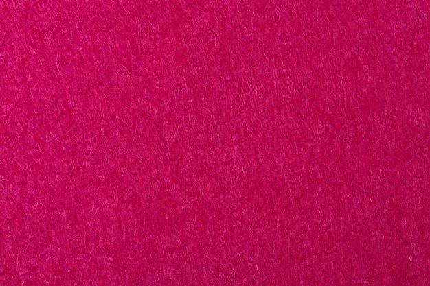 Textura áspera de feltro vermelho. Foto em alta resolução.