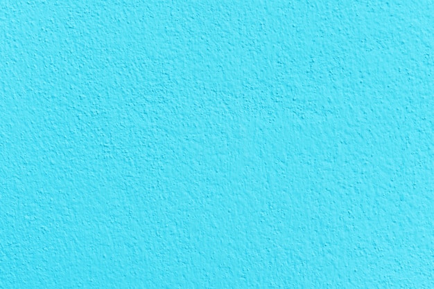 Textura azul do cimento ou do muro de cimento para o fundo.