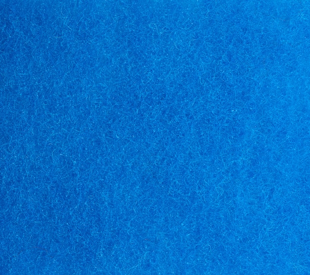 Textura azul de una esponja de cocina con fibras, marco completo