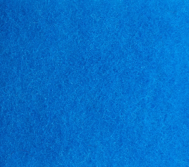 Textura azul de una esponja de cocina con fibras, marco completo