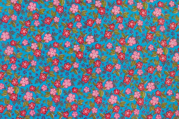 Textura azul del fondo del paño del estampado de flores.