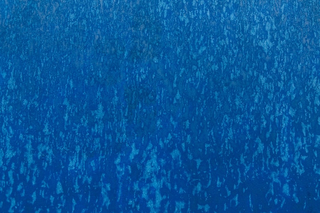 Textura azul con gotas en la pared