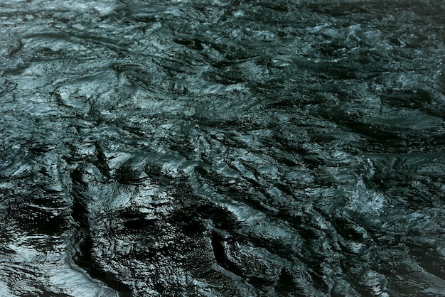 Textura azul marino abstracta del fondo del agua de la onda de la cascada