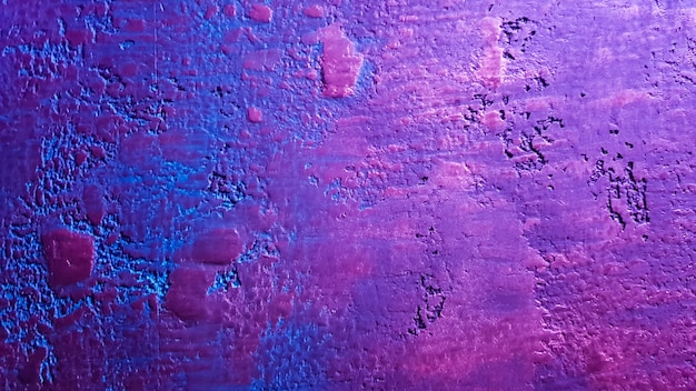 Textura azul rosa para design de plano de fundo. Textura clássica delicada. Fundo colorido Parede colorida. Fragmento de uma parede de pedra com sinais coloridos e iluminação de pintura. fundo com espaço de cópia.