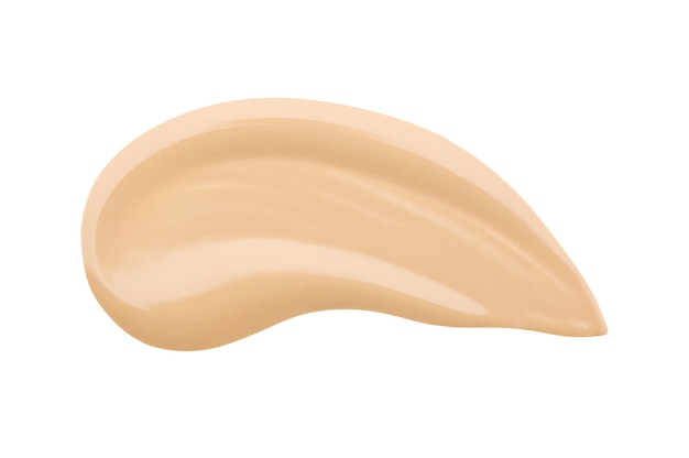 Textura de base beige manchada sobre fondo blanco aislado. Gota de líquido, muestra desnuda de productos cosméticos para el cuidado de la piel. Corrector para un tono de piel perfecto. Producto de maquillaje de belleza para mujeres.