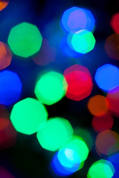 Textura de bokeh de luces multicolores de navidad y año nuevo