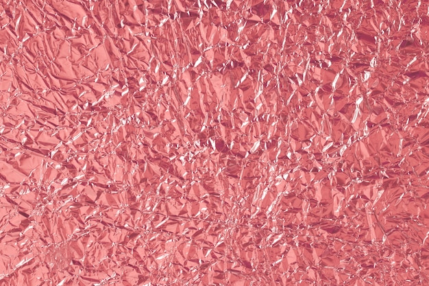 Textura brilhante de folha de ouro rosa, papel de embrulho vermelho abstrato