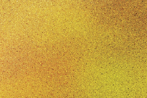 Foto textura de brillo dorado que es dorado con un fondo dorado