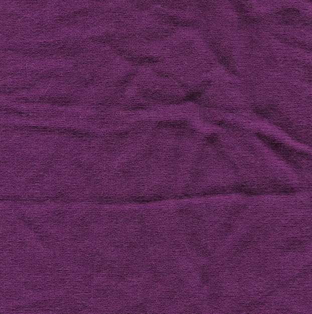 Textura de bufanda de lana de punto de color púrpura lila hecha a mano Patrón de bufanda de lana de tela simple púrpura violeta de invierno