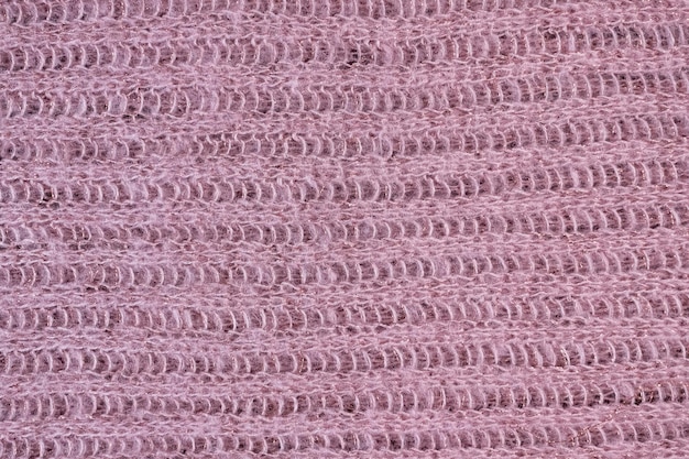 Textura de bufanda rosa tejida