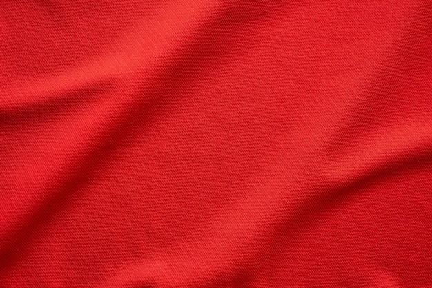 Textura de camiseta de fútbol de tela de ropa deportiva roja cerrar