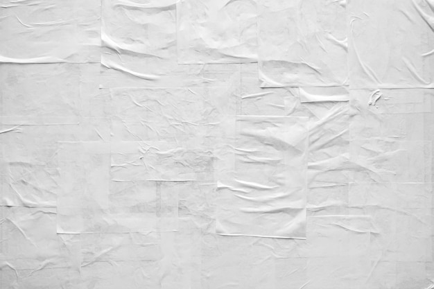 Foto textura de cartel de papel arrugado y arrugado blanco en blanco
