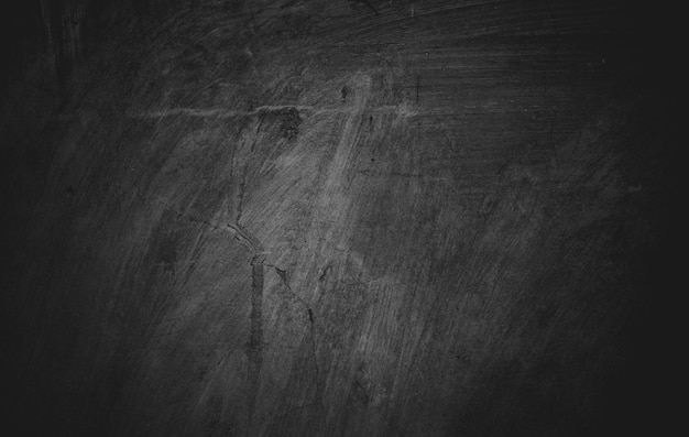Textura de cemento de hormigón negro ligeramente claro para el fondo Grunge oscuro angustiado con arañazos Paredes oscuras aterradoras superpuestas