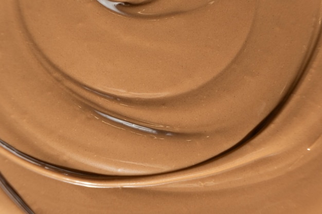 Textura de chocolate de leche derretido vista superior macro