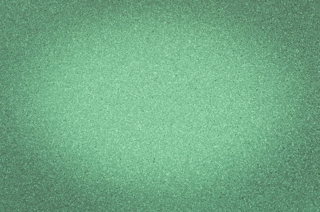 La textura del color verde del granito con pequeños puntos, con el viñeteado, utiliza el fondo.