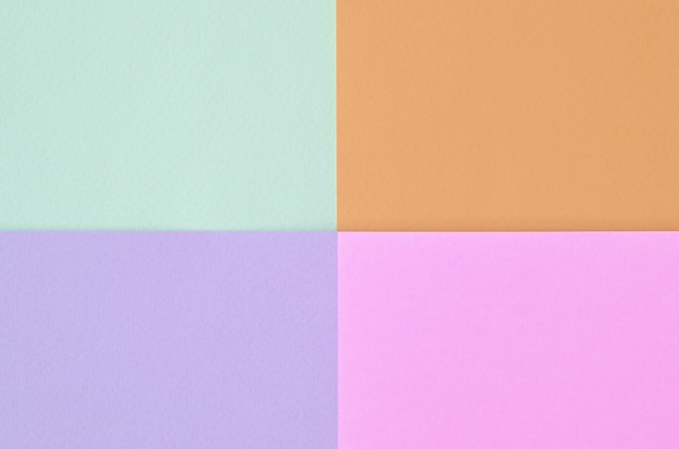 Foto textura de colores pastel de moda. papeles de estampado geométrico rosa, violeta, naranja y azul.