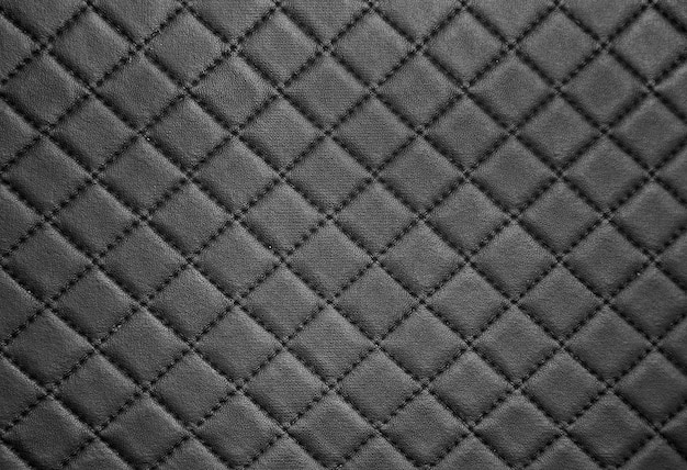 Textura de cuero negro con fondo de costura